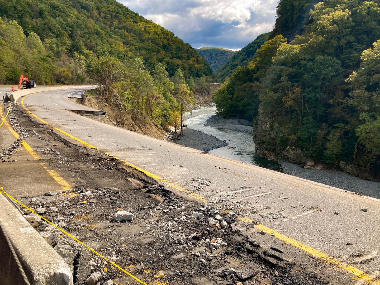 54074386848_0b123a79f8_o Road damaged with mountains surrounding.